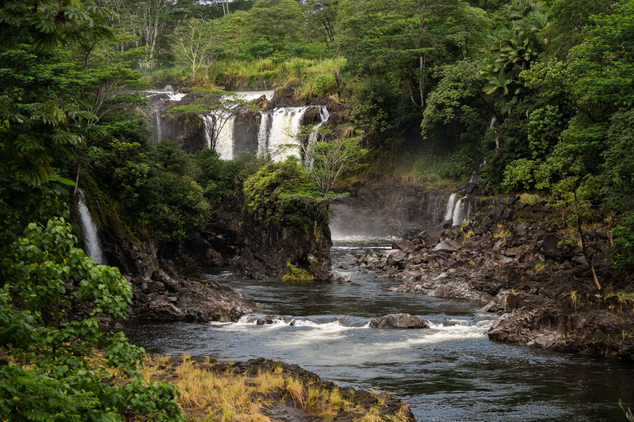 Big Island waterfall tour stop at Pe'epe'e Falls in the Wailuku River State Park.