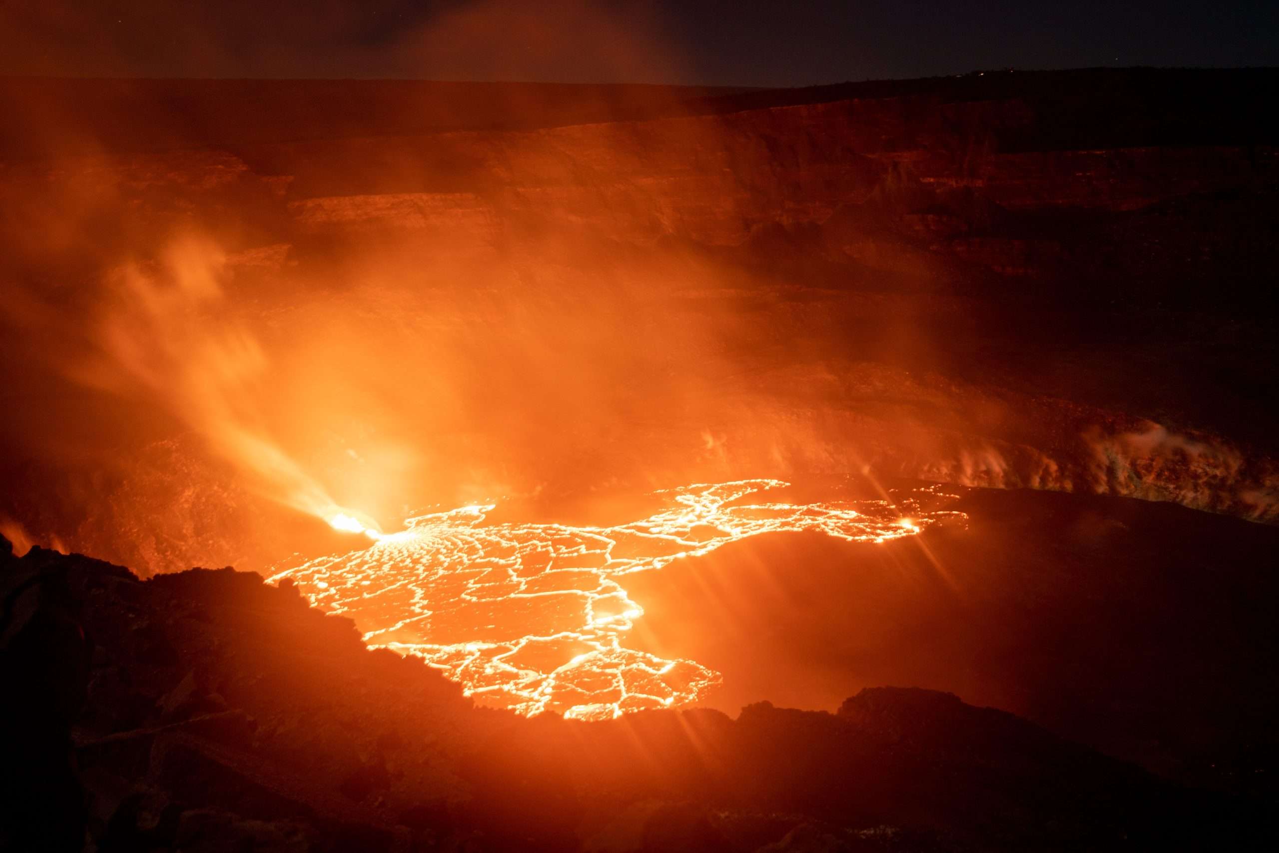 Lava erupting from Kilauea at night in Hawaii Volcanoes National Park.