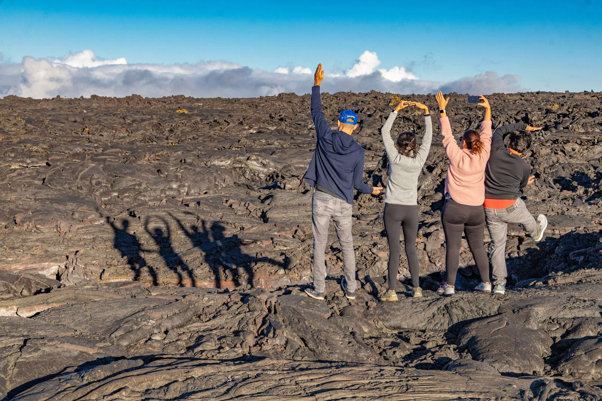 Big Island day tour guests exploring lava fields on Mauna Loa.