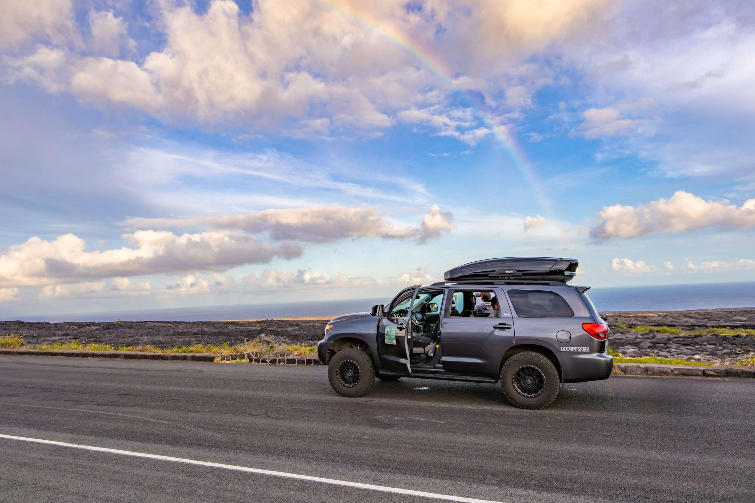 Kona tour guests seeing a rainbow in Hawaii Volcanoes National Park.