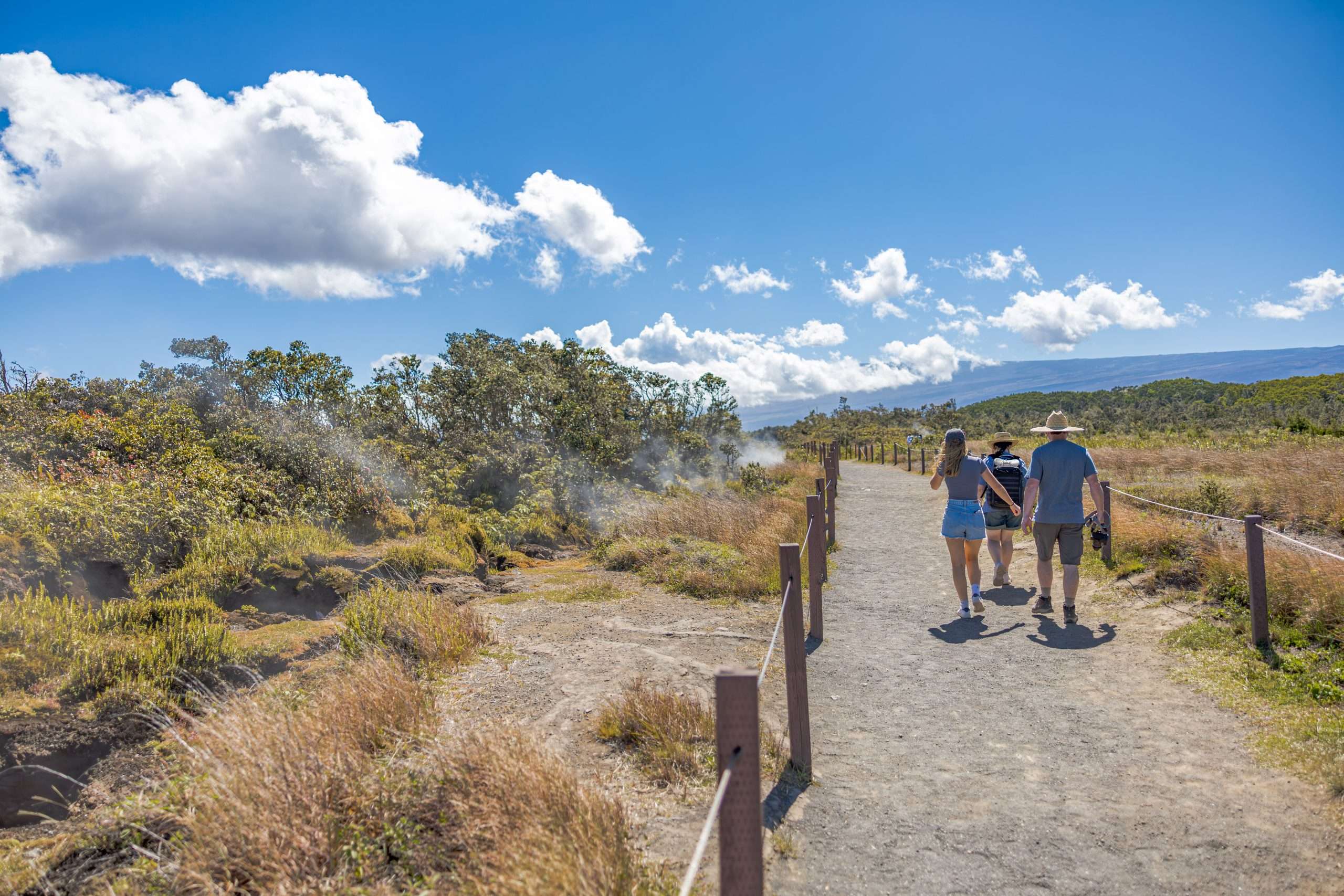 Big Island grand circle tour guests walking along the steam vents at Hawaii Volcanoes National Park.