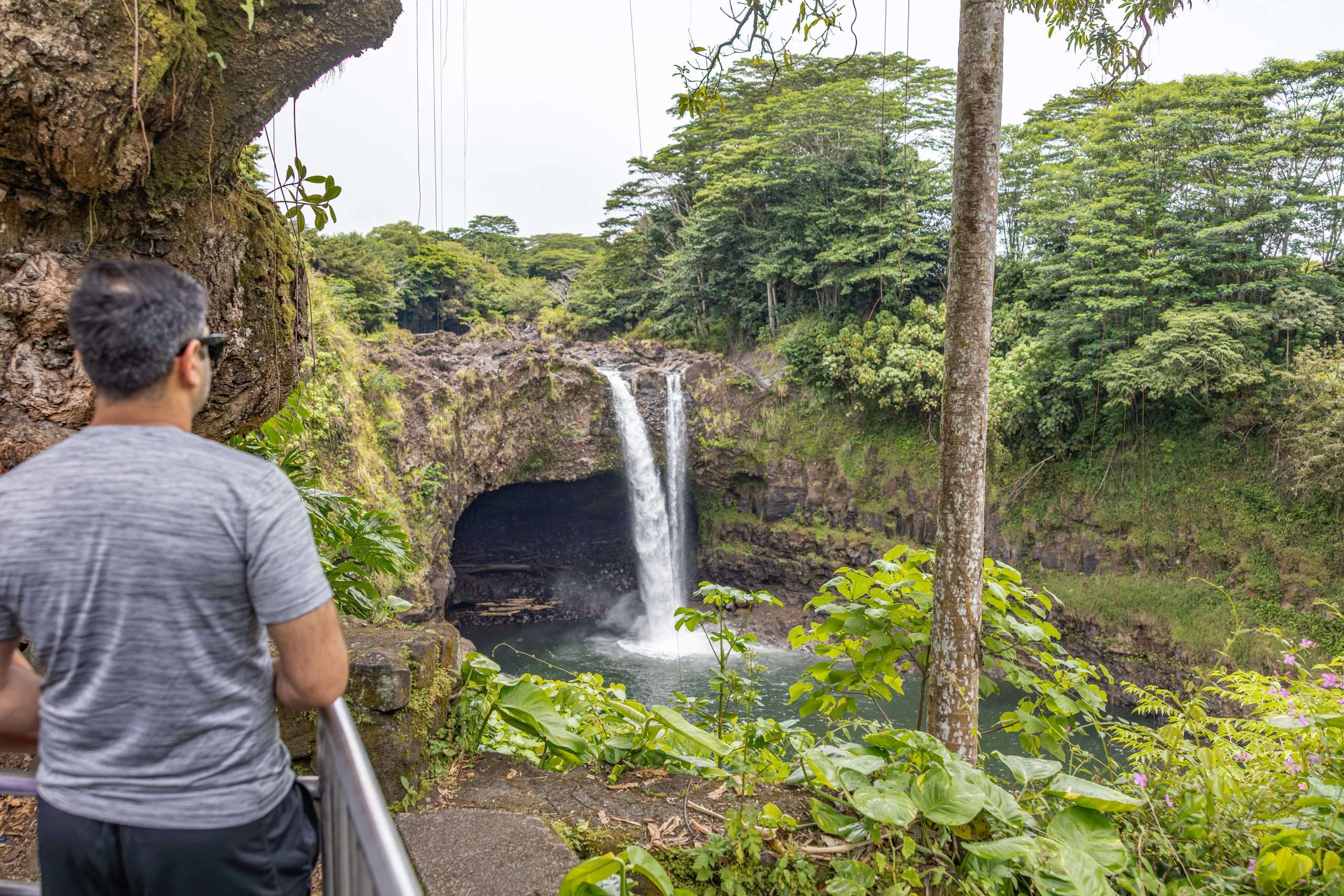 Hawaii Waterfall Tours Hawaii waterfall tour guests observing Rainbow Falls.
