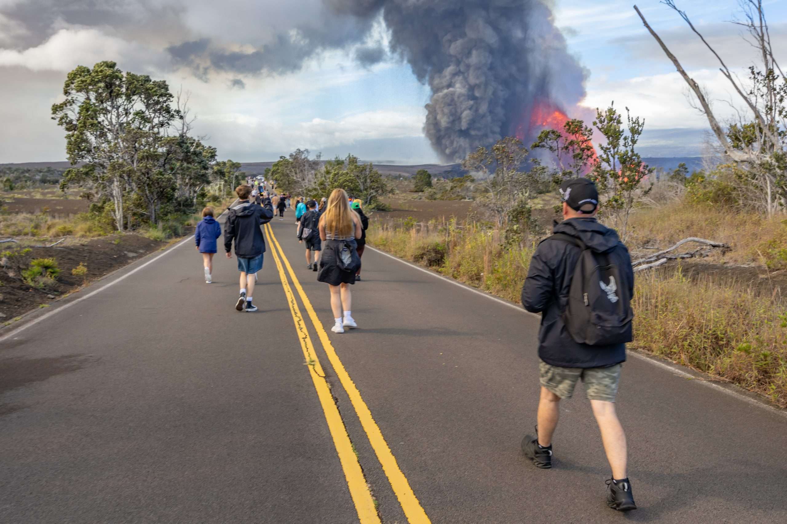 Walking along Crater Rim Drive in Hawaii Volcanoes National Park on a Big Island volcano tour.